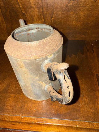 Rust primitive oil or watering can