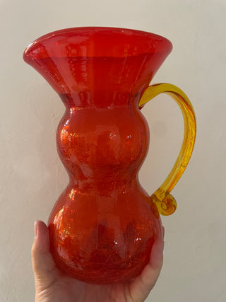 Red art glass vase with yellow handle