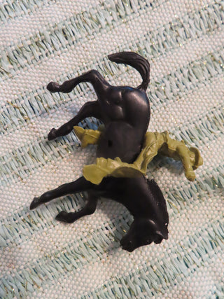 black horse and green cowboy