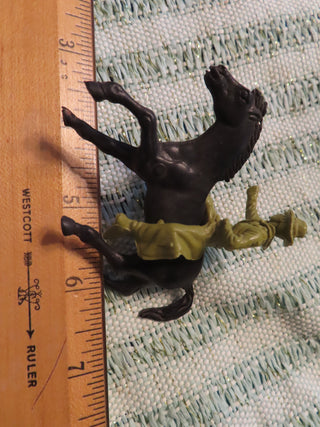 black horse and green cowboy