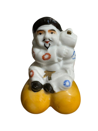 Japanese Porcelain Figurine Man Carrying Sack