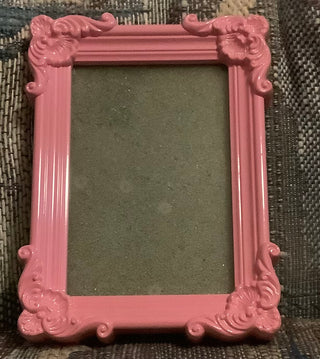 Pink ornate flower edge details picture frame.