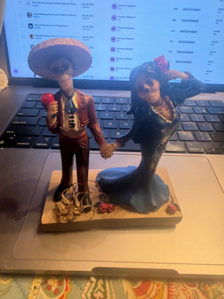 Day of the Dead Holding Hand Skulls