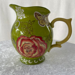 green ceramic pitcher w/ flowers  & butterfly
