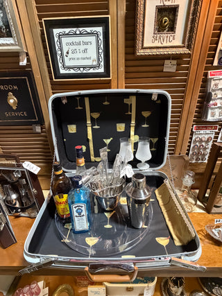 Tan Samsonite suitcase bar
