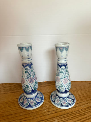 Pair of blue, pink & green floral ceramic candlesticks