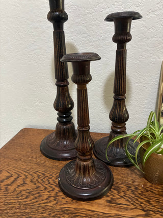 Set of 3 metal ornate candlesticks