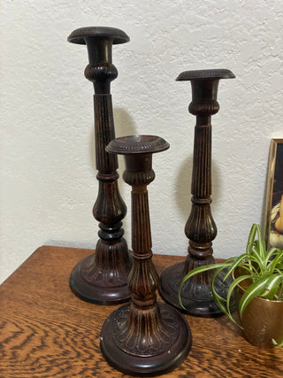 Set of 3 metal ornate candlesticks