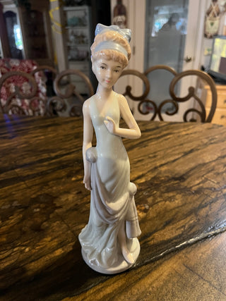 Woman In Mint Green Dress w/Blue Hair Bow and Sash Porcelain Figurine