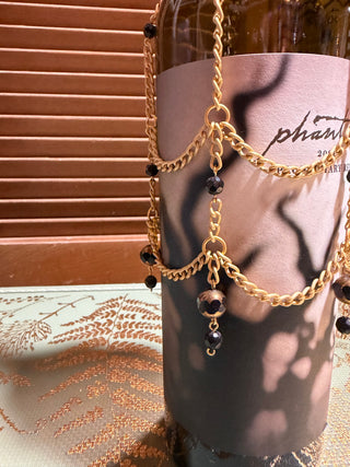 Black/gold wine bottle cover