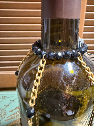 Black/gold wine bottle cover