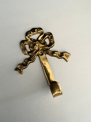 Brass bow hook