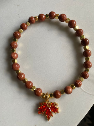 Goldstone beaded bracelet/maple leaf charm