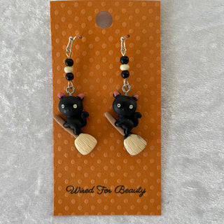 Halloween earrings, black cats on brooms