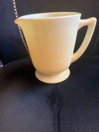 Vintage Deco  McKee Custard Seville Yellow Uranium Measuring 4 Cup with a footed handle  VV