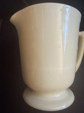Vintage Deco  McKee Custard Seville Yellow Uranium Measuring 4 Cup with a footed handle  VV