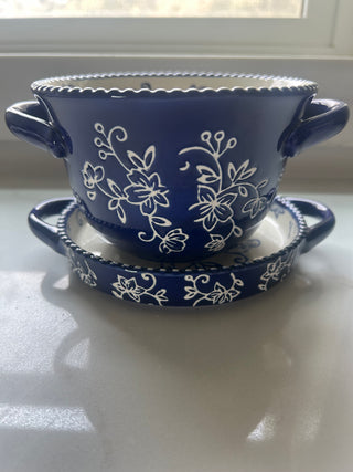Temp-tations by Tara Floral Lace soup crock in Cobalt Blue, featuring a delicate white floral pattern and a bead-textured rim.Design: Cobalt blue ceramic with a white floral lace pattern and handle accents.Material: Constructed from durable ceramic design