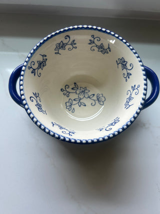Temp-tations by Tara Floral Lace soup crock in Cobalt Blue, featuring a delicate white floral pattern and a bead-textured rim.Design: Cobalt blue ceramic with a white floral lace pattern and handle accents.Material: Constructed from durable ceramic design