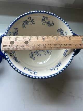 Temp-tations by Tara Floral Lace soup crock in Cobalt Blue, featuring a delicate white floral pattern and a bead-textured rim.Design: Cobalt blue ceramic with a white floral lace pattern and handle accents.Material: Constructed from durable ceramic design