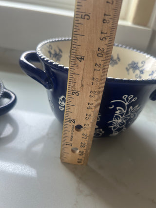 Temp-tations by Tara Floral Lace soup crock in Cobalt Blue, featuring a delicate white floral pattern and a bead-textured rim.Design: Cobalt blue ceramic with a white floral lace pattern and handle accents.Material: Constructed from durable ceramic design