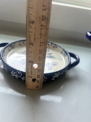Temp-tations by Tara Floral Lace soup crock in Cobalt Blue, featuring a delicate white floral pattern and a bead-textured rim.Design: Cobalt blue ceramic with a white floral lace pattern and handle accents.Material: Constructed from durable ceramic design