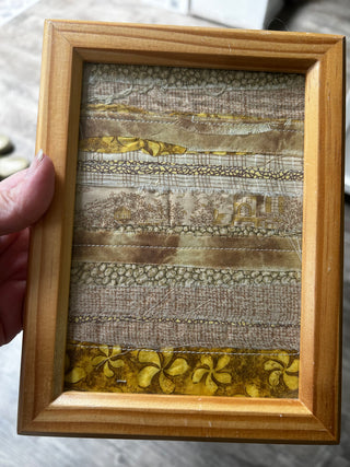 Framed fabric collage goldbrn