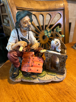 Vintage Norleans Porcelain Man Building a Doghouse Figurine