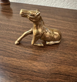 Vintage brass horse resting
