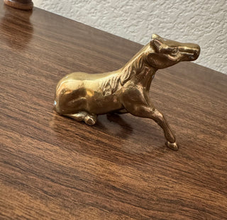 Vintage brass horse resting