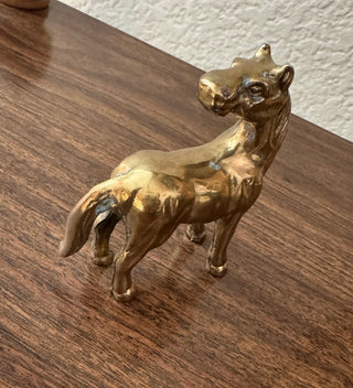 Vintage standing looking back brass horse