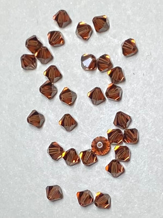 Swarovski Bicone 5mm Smoky Topaz 30/pk