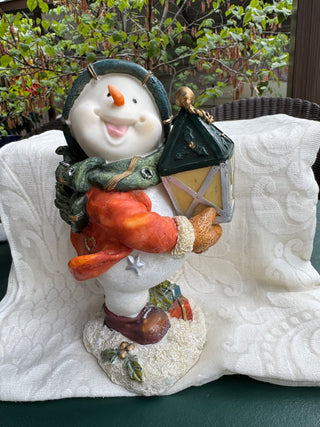 Smiling Snowman Figurine Holding Lantern