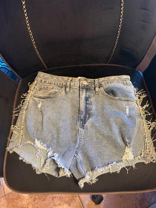 Fashion Nova distress denim shorts with fringe rhinestone tassels along the side  size 3