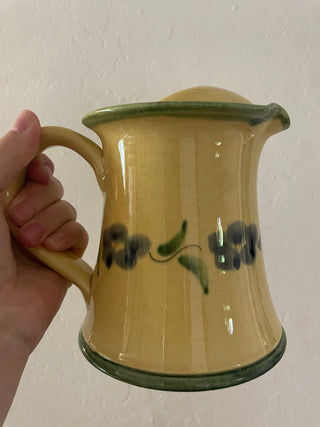 Yellow teapot with blue flowers