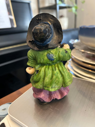 Witch In Green Shirt Holding Rat W/ Cauldron