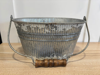 Oval pale with wooden handle