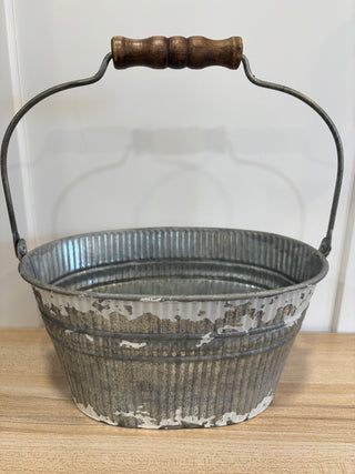 Oval pale with wooden handle