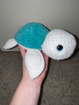 White and teal turtle