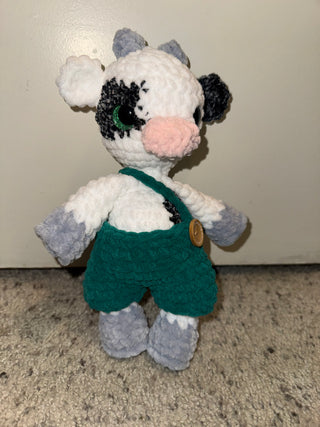 Cow in green overalls