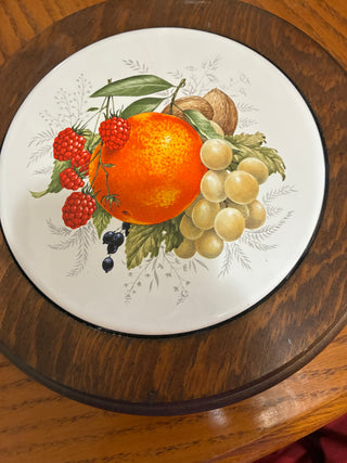 Vintage German porcelain and wood trivet with fruit