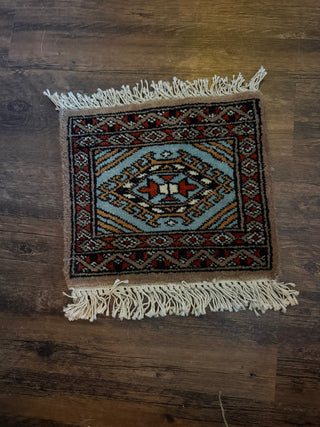 miniature, hand-knotted Oriental tribal rug