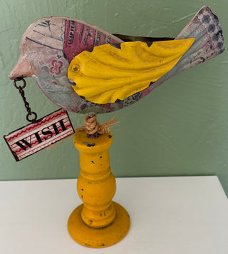 vintage style folk art bird figurine.
