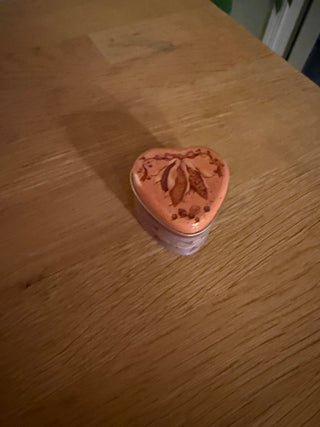 Small used heart harvest candle tin