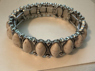 silver colored with white stone bracelet