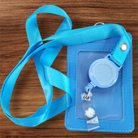 Interchangeable Badge Reel Lanyard with Retractable Reel: Lanyard Light Blue.  Badge Button: Light Blue with darker snowflakes.|62688