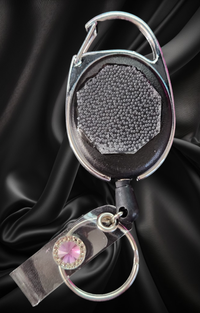 Carabiner with Belt Clip Interchangeable Badge Reel with Retractable Reel. Badge Button: Lavender Diamond. Our Interchangeable Badge Reels are made to be used with our Interchangeable Badge Reel Charms.|63936