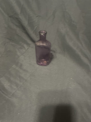 small dark purple bottle rsv