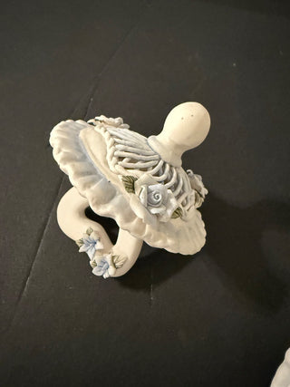 decorative collectible, specifically a Capodimonte porcelain baby pacifier.R CD