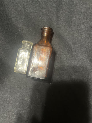 antique bottles one clear one rsv