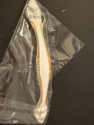 Cream and gold metal drawer pull RCD